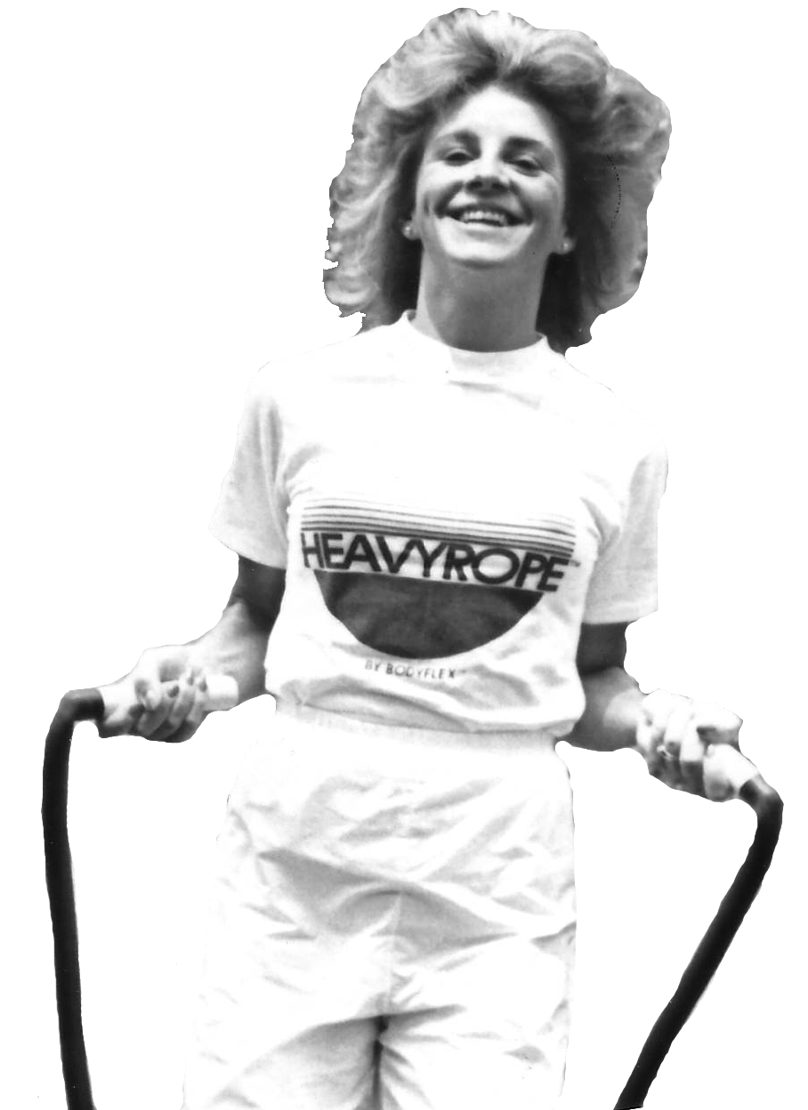 An archival photograph of founder Peaches McCahill with fitness equipment